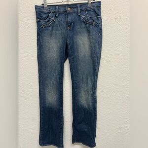 Vintage low-rise western inspired distressed bootcut jeans